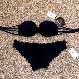 Never worn! Shade shore two piece black bathing suit. Top 34B, bottoms size M.